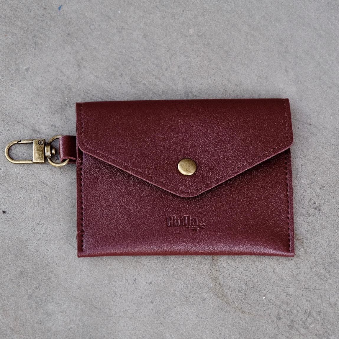 A small crimson pouch