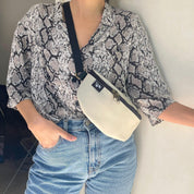 פאוץ' הלגה שמנת דמוי עור