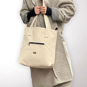 תיק צד Tommy שמנת דמוי נובוק